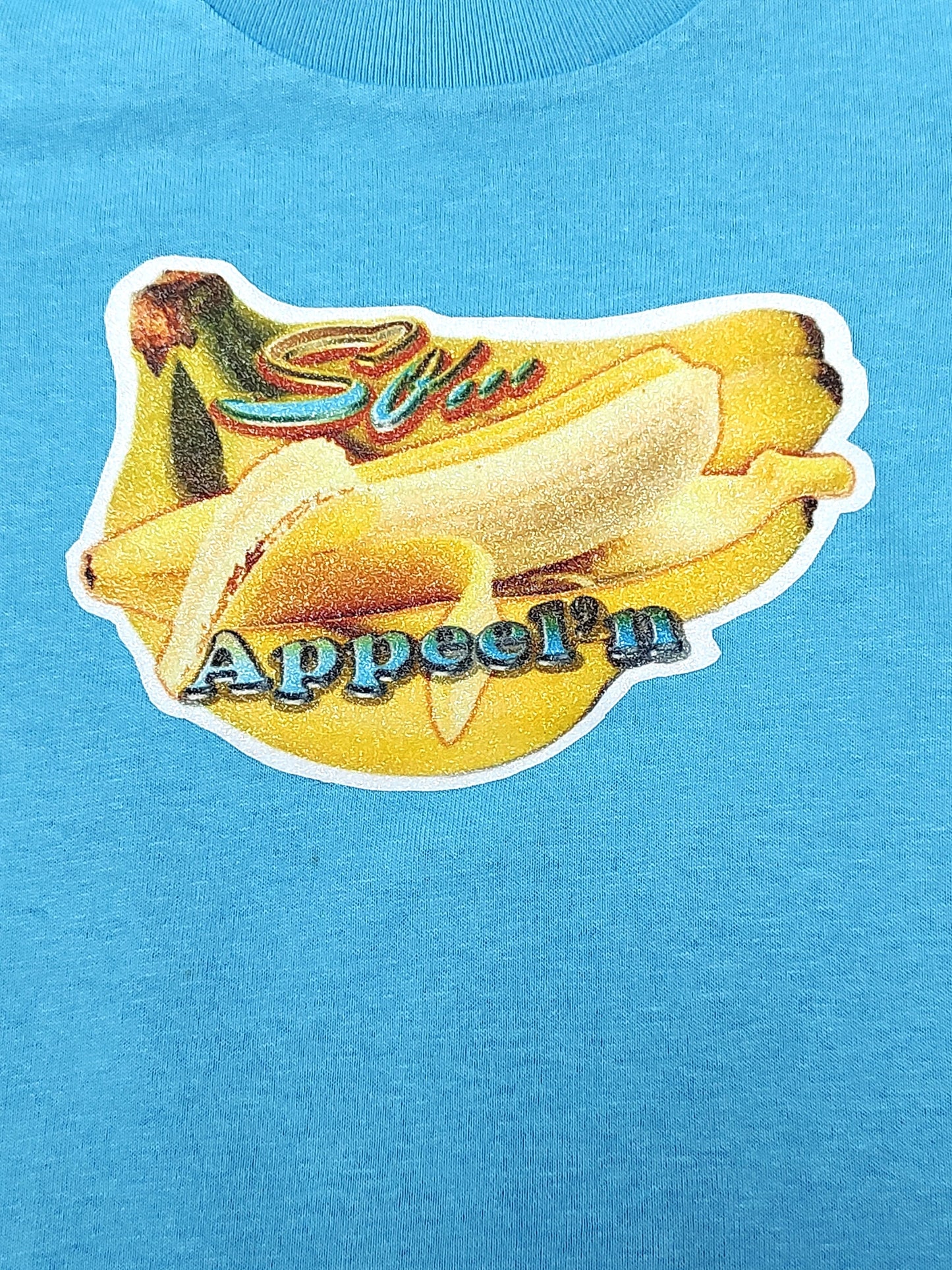So Appeel’n blue toddler tee glitter banana hand-pressed  
Glitter banana toddler shirt 12 months
www.justsaynpromos.com