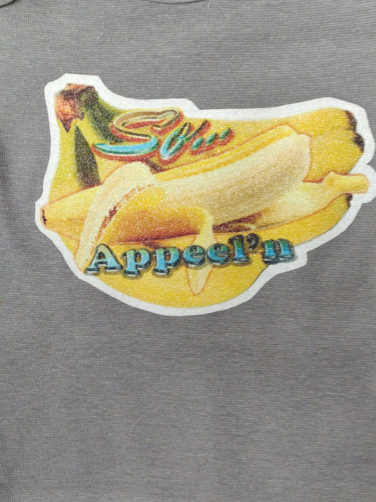 So Appeelin gray baby bodysuit glitter banana hand-pressed  
Banana-themed baby bodysuit 6-12 months
www.justsaynpromos.com