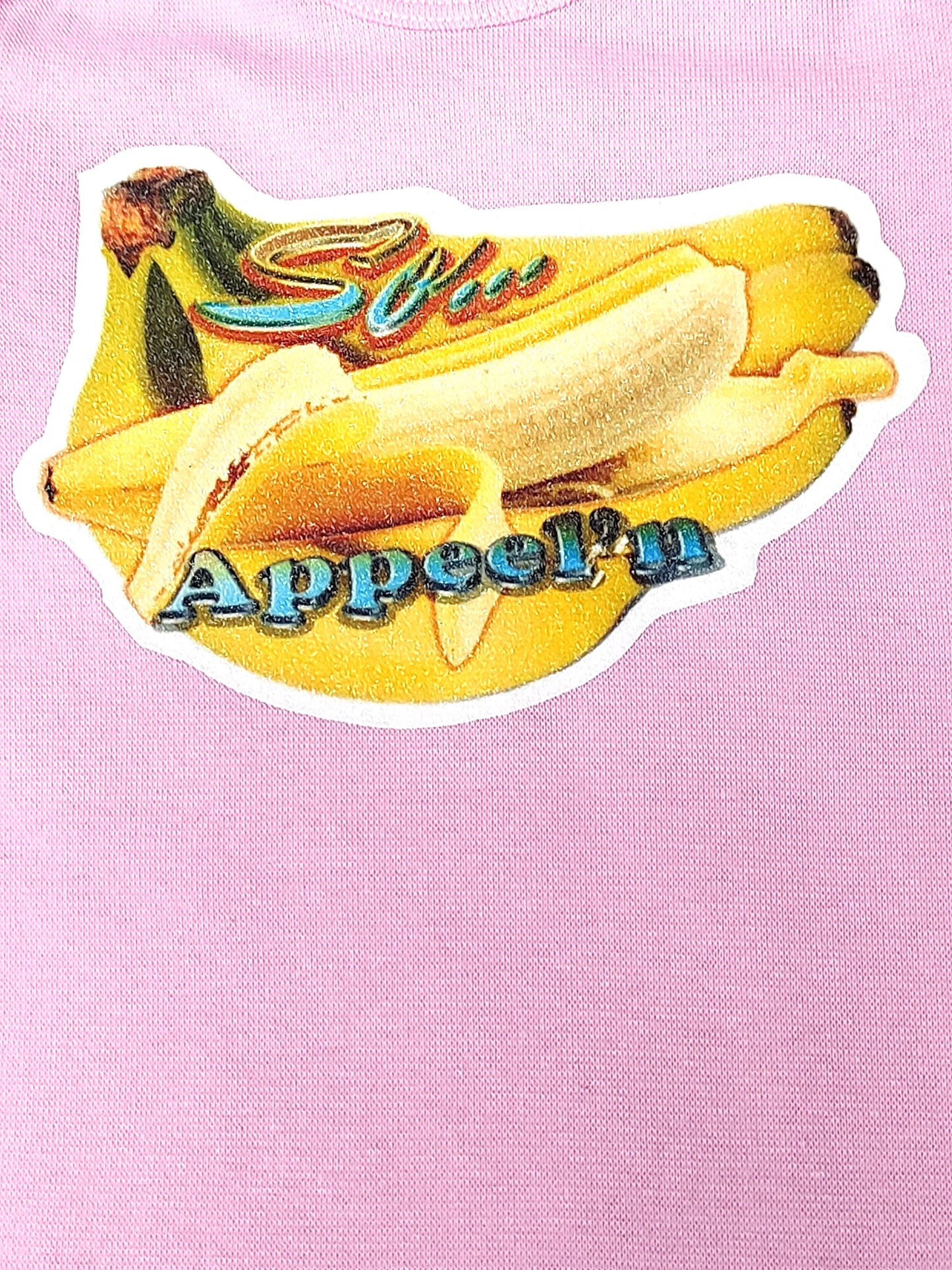 So Apeel’n pink baby bodysuit glitter banana hand-pressed  
Pink banana-themed baby bodysuit 12-18 months
www.justsaynpromos.com