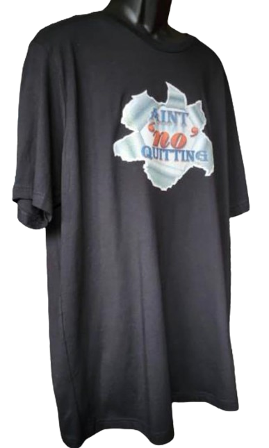 A black short-sleeved t-shirt with a dynamic graphic of torn fabric on the chest, revealing the phrase "AIN'T 'NO' QUITTING" in blue and orange text. This tee is part of a tee mug hat bundle, making it an excellent component of a never quit gift bundle and an empowerment apparel set.
www.justsaynpromos.com