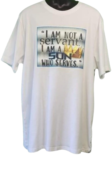  A white Inspirational Christian Glitter Shirt is displayed on a mannequin, facing forward. The center of the shirt features a large rectangular graphic with a subtle blue and white textured background, designed to look like a frame. Inside, the dark grey text reads: "I AM NOT A servant. I AM A SON WHO SERVES." The word "SON" is larger and bolder, and a golden crown with glittering details is placed above it. This unisex Christian Crown Tee is a perfect example of a glitter custom faith-based graphic tee. 
