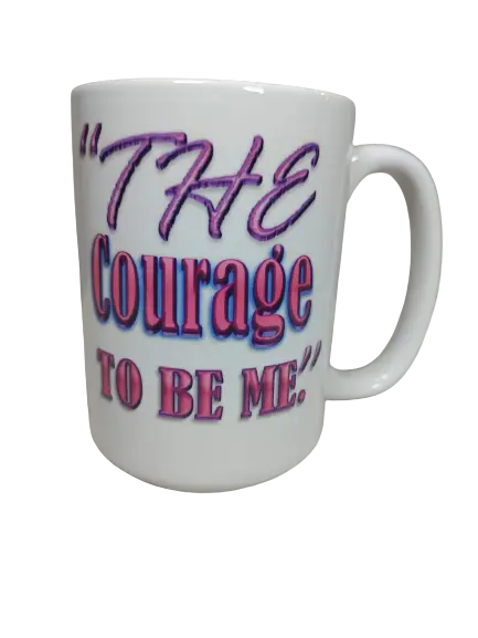 A white 15oz courage mug for women, featuring the complete phrase "THE COURAGE TO BE ME" in striking pink and purple lettering. The design of this motivational mug for her makes it an ideal women empowerment mug and an inspirational mug for women, encouraging self-belief. www.justsaynpromos.com
