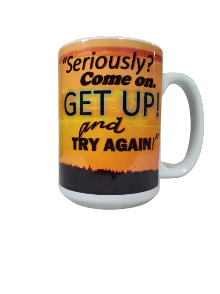 A white 15oz motivational quote coffee mug showcasing a vibrant orange and yellow sunset scene with a dark silhouette of a landscape at the bottom. Bold black and orange text proclaims, "Seriously? Come on. GET UP! and TRY AGAIN!". This funny motivational mug serves as a powerful get up and try again mug and a meaningful gift for someone struggling.
www.justsaynpromos.com